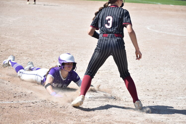 Staff photo by Ari Selvey New Ulm's Maddie Backer slides into third base during a nonconference softball game against New Prague Saturday at Caswell Park in North Mankato.